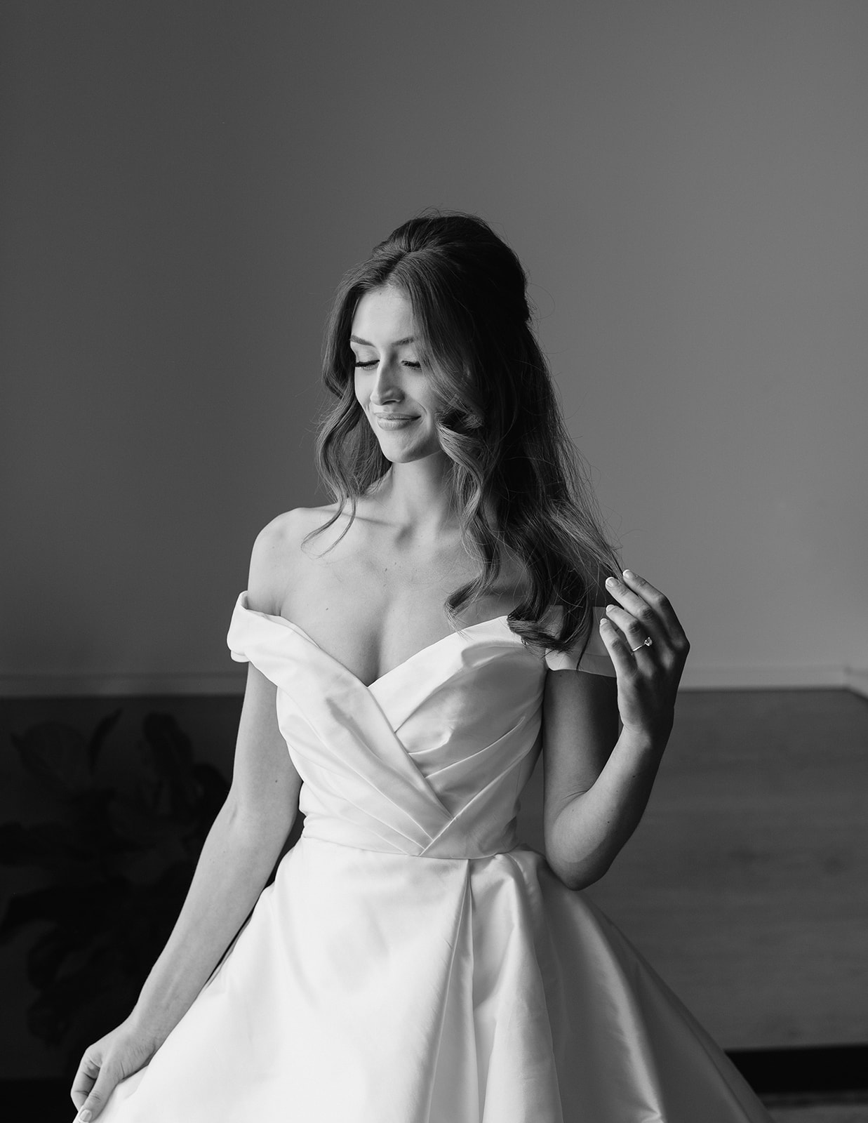 Elegant bride with off-the-shoulder white wedding dress