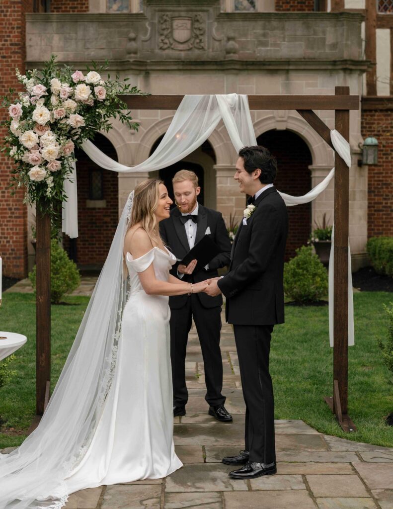 Wedding ceremony at Pinecroft Mansion in Cincinnati, Ohio outside of the venue.