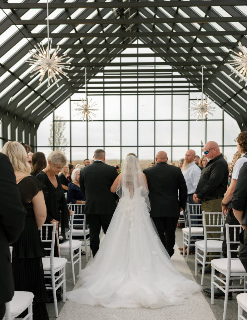 Bride and groom embracing outdoors at sunset, captured by a Columbus Ohio wedding photographer.