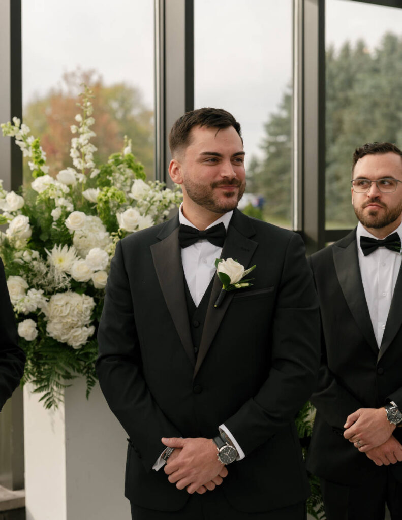 Wedding party dressed in classic black and white attire for a timeless ceremony.