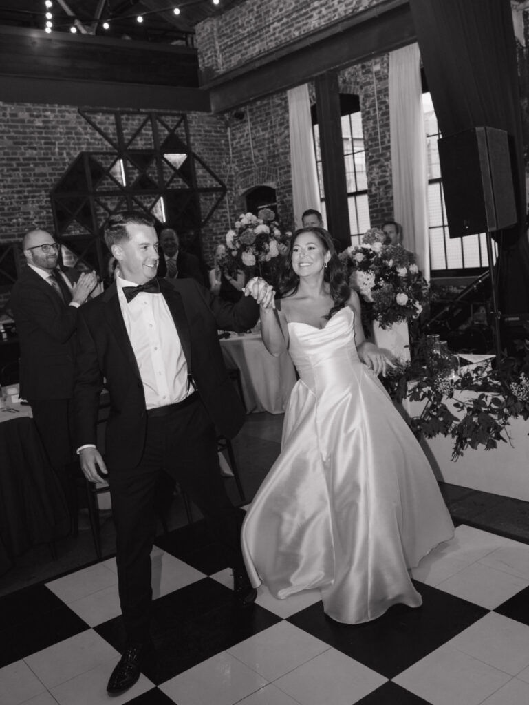 Film-style image of The Ellis reception space lit with candles and soft ambient light.