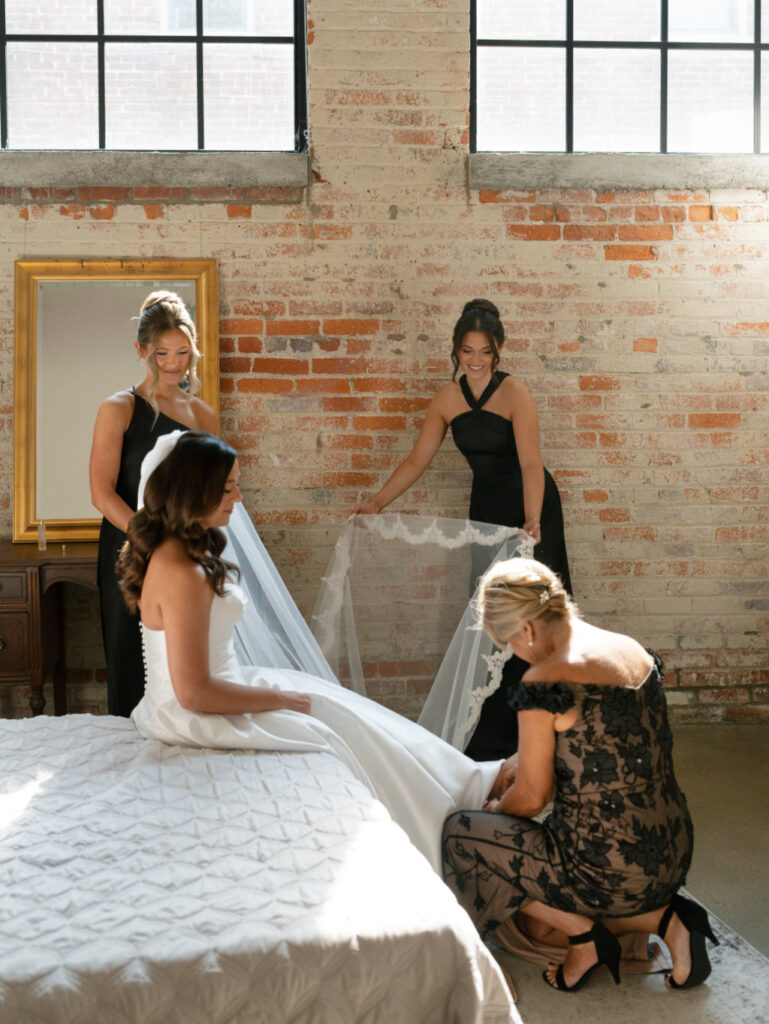 Candid bridal prep moment photographed by Stevie J Davis using digital and film.