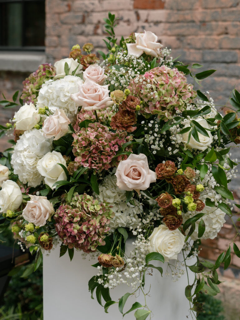 Close-up of lush wedding florals used in The Ellis ceremony design.