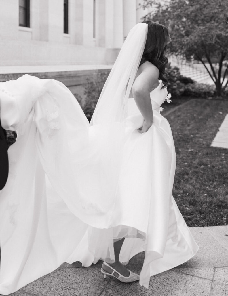 Stylish full-length portrait of the bride in her wedding gown at The Ellis.