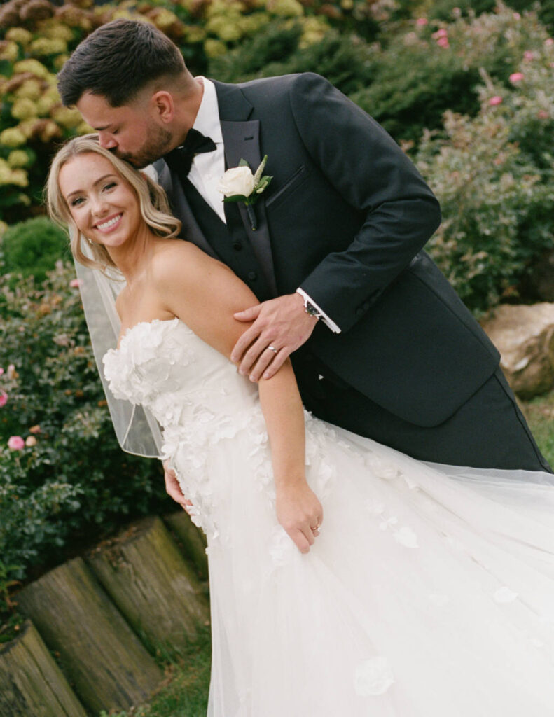 The couple celebrating outdoors surrounded by lush Ohio greenery.