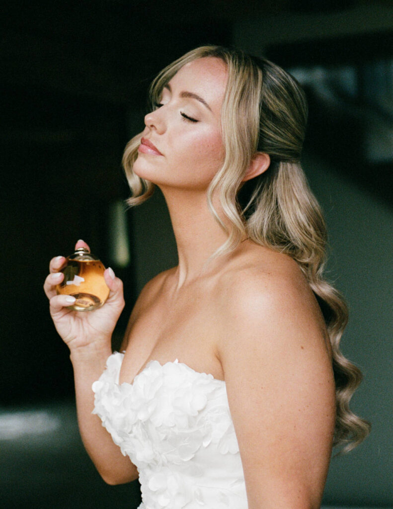 Bride standing in the greenhouse-style ceremony space at The Everhart Gathering Place.