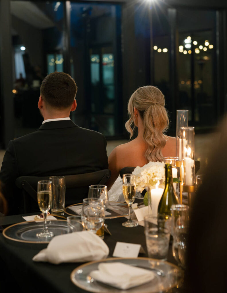 Reception décor details featuring candles and elegant table styling.