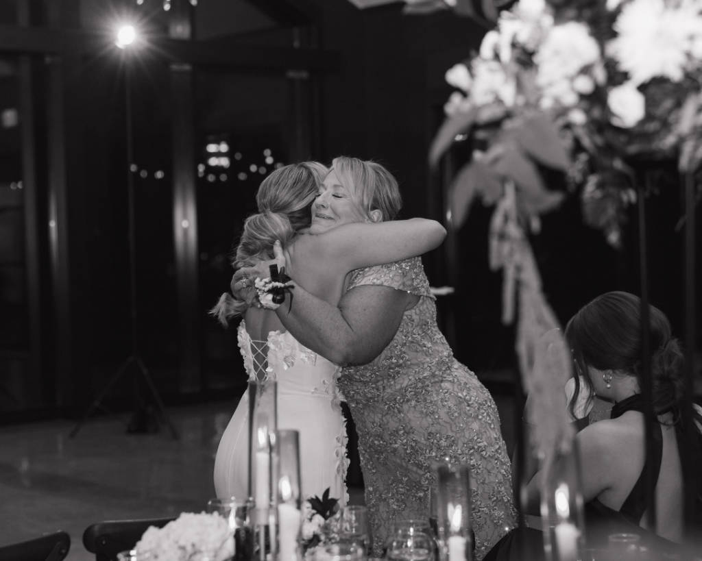Mother and bride hugging during the wedding reception in Wyandot County, Ohio.