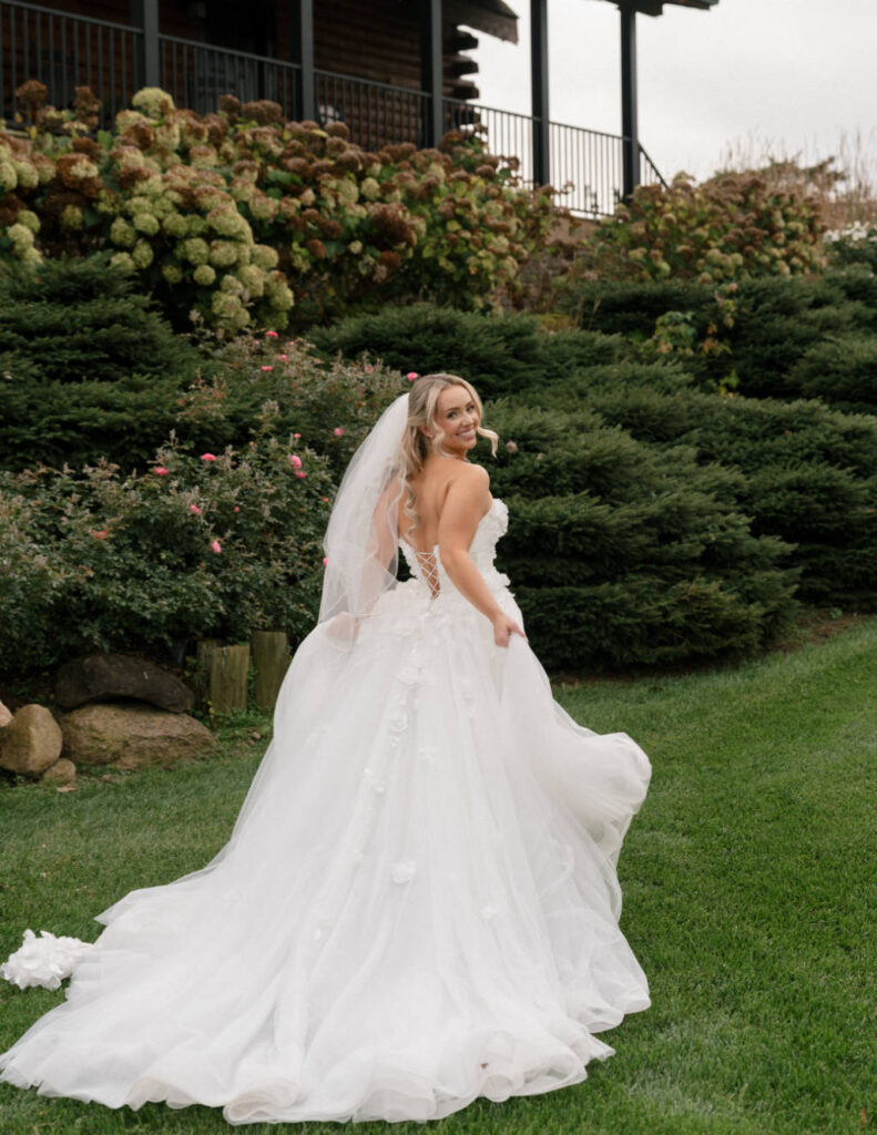 Bride standing in a field at sunset during her Wyandot County wedding.