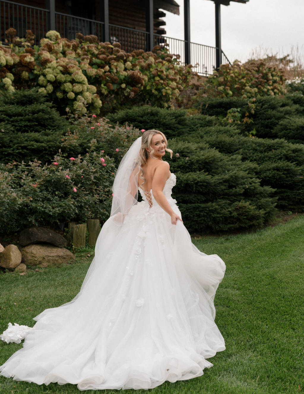 Bride standing in a field at sunset during her Wyandot County wedding.